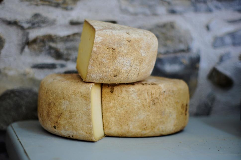 Free Image of Three Pieces of Cheese Stacked Together 