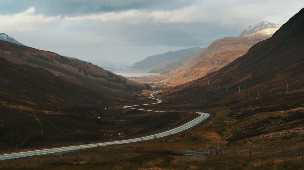 Free Image of A Scenic View of a Winding Road in the Mountains 