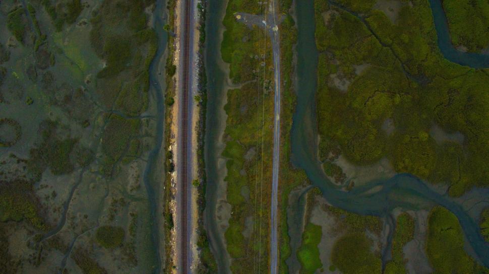 Free Image of Aerial View of Road Cutting Through Field 