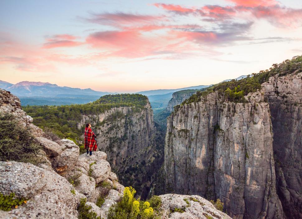 Free Image of Person Standing on Top of a Mountain 