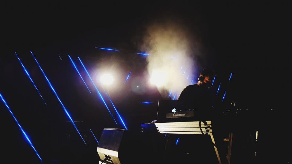 Free Image of Man Sitting at Keyboard on Stage 