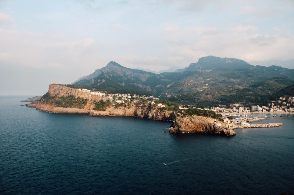 Free Image of Small Island Amidst Body of Water 