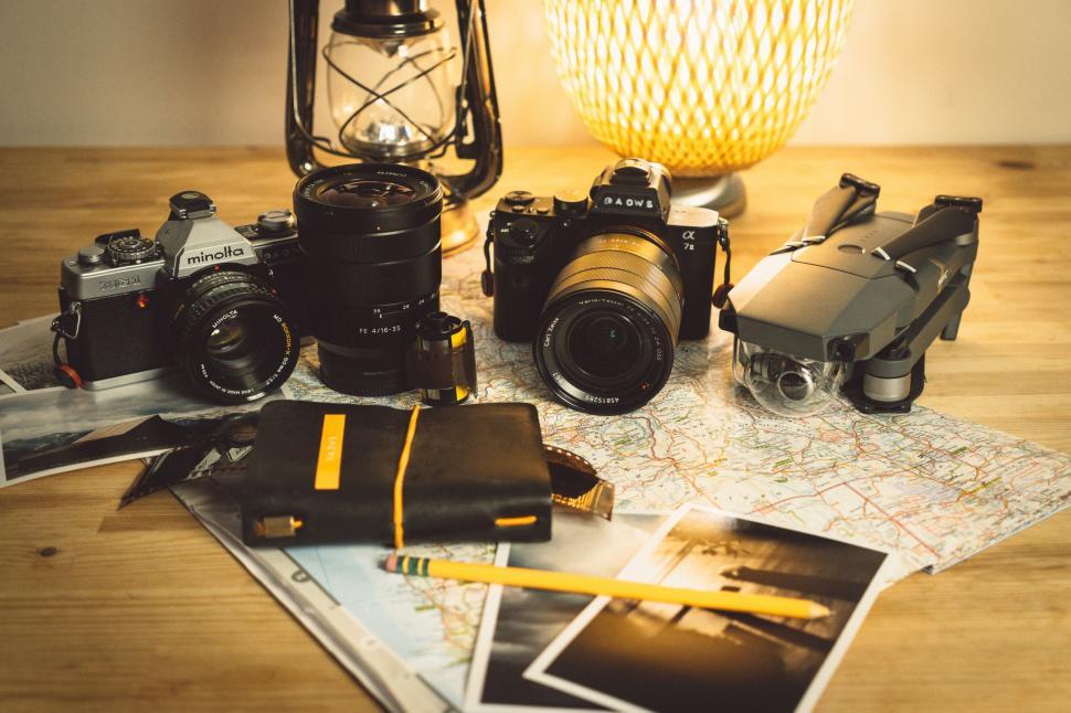 Free Image of Table With Camera and Various Items 