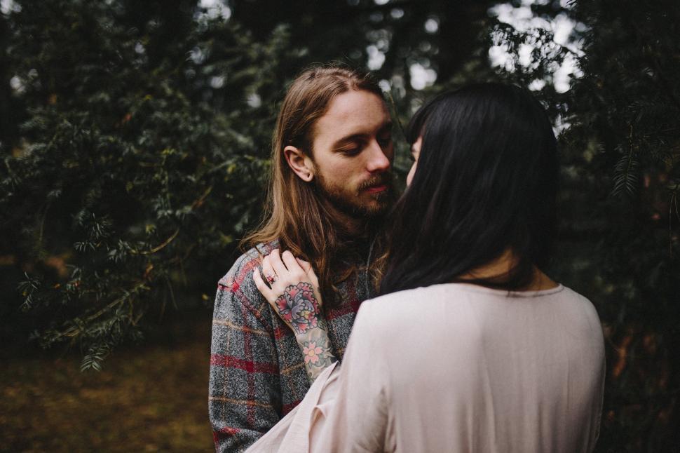 Free Image of Man and Woman Standing in Forest 