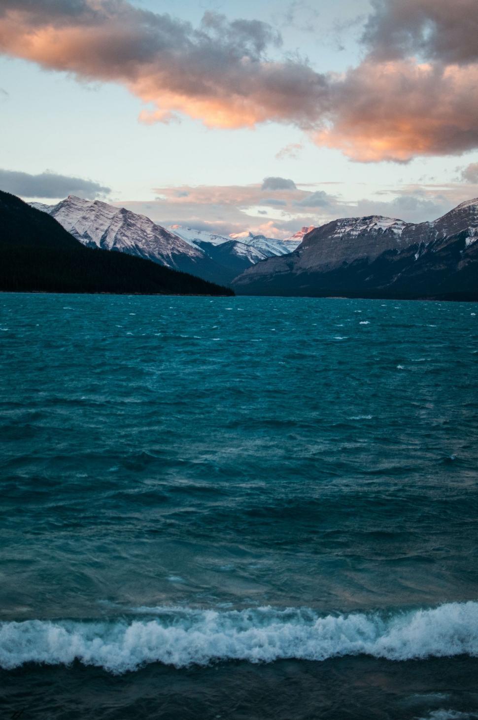 Free Image of Majestic Mountains Towering Over a Serene Lake 