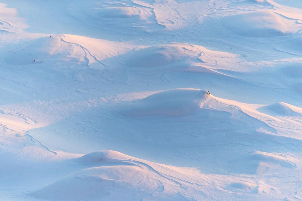Free Image of Snowboarder Descending Snowy Hill 