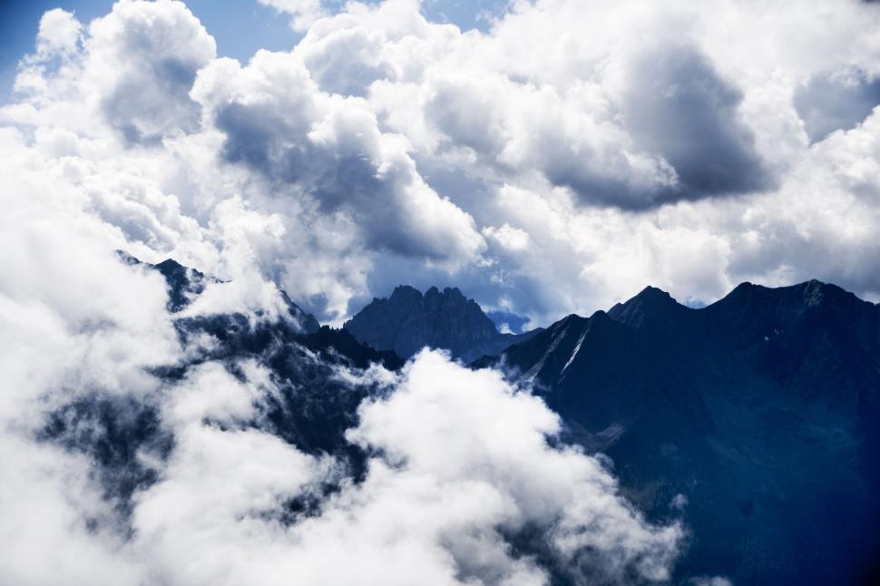 Free Image of A View of Clouds and Mountains From an Airplane 