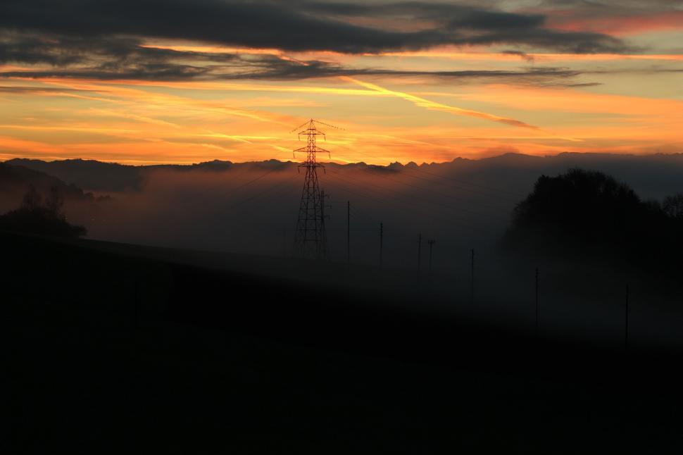 Free Image of Sun Setting Over Mountain Range 