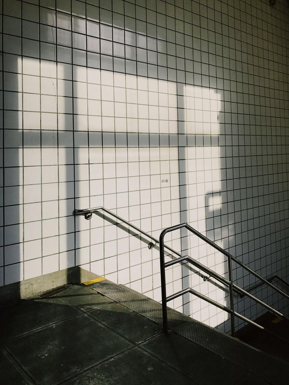 Free Image of Stairwell Ascending Towards Tiled Wall 