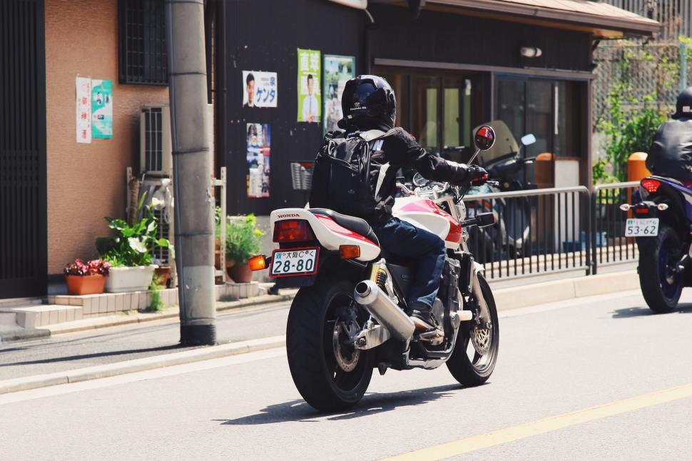 Free Image of Couple Riding Motorcycles on Street 