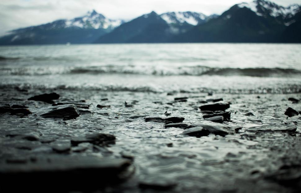 Free Image of Beach With Mountains in the Background 