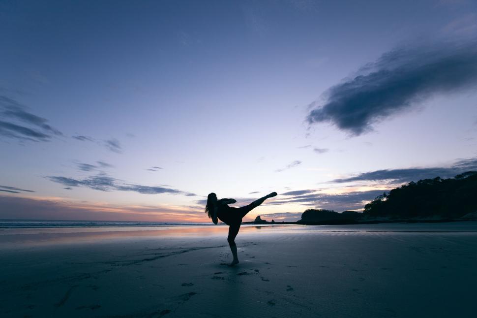 Free Image of Person Performing Handstand on Beach 