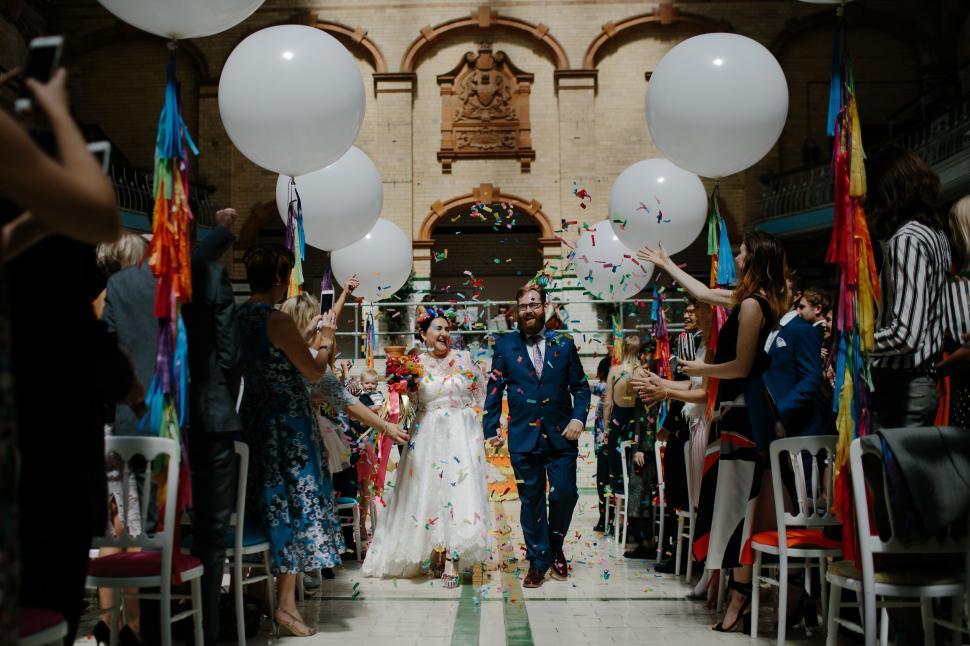Free Image of Bride and Groom Walking Down the Aisle 