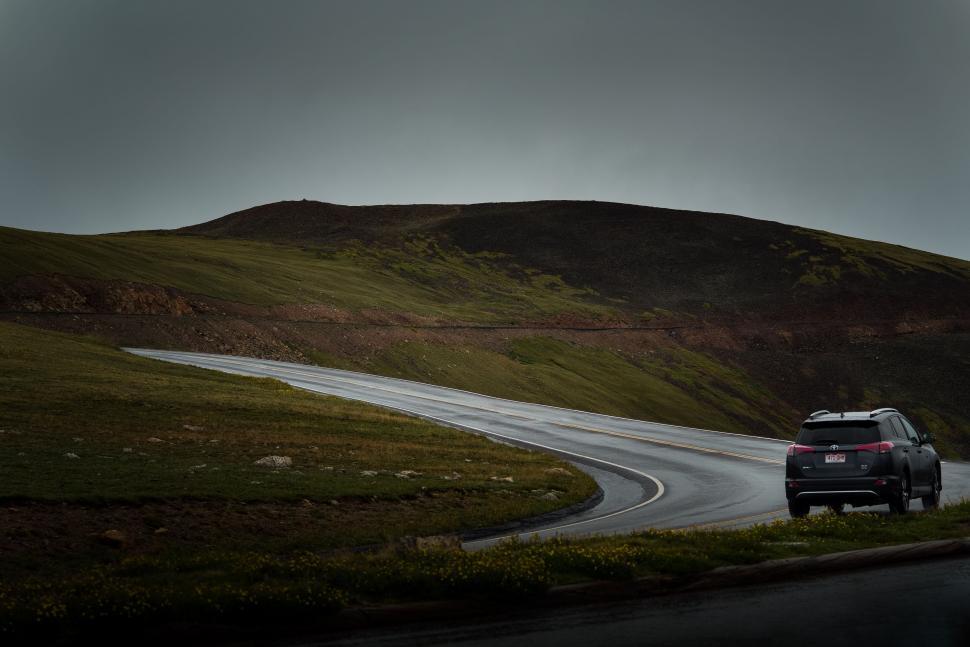Free Image of Truck Driving Down a Road 