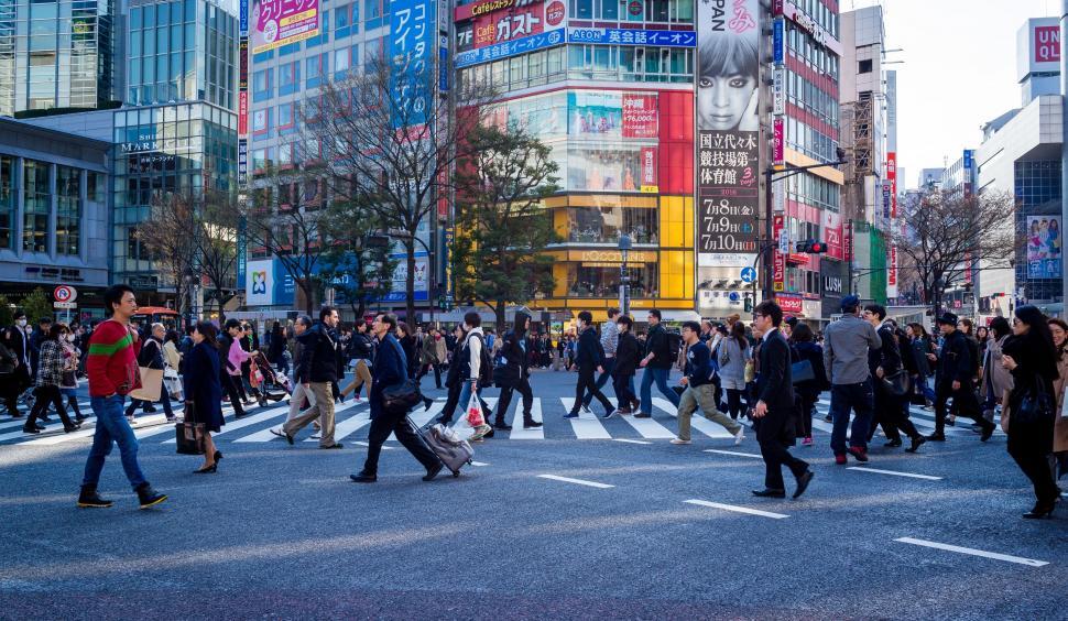 Free Image of Crowd of People Walking Across Street 
