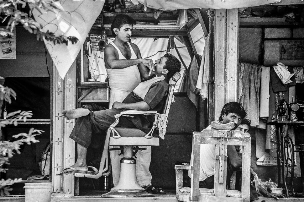 Free Image of Barber Cutting Mans Hair 