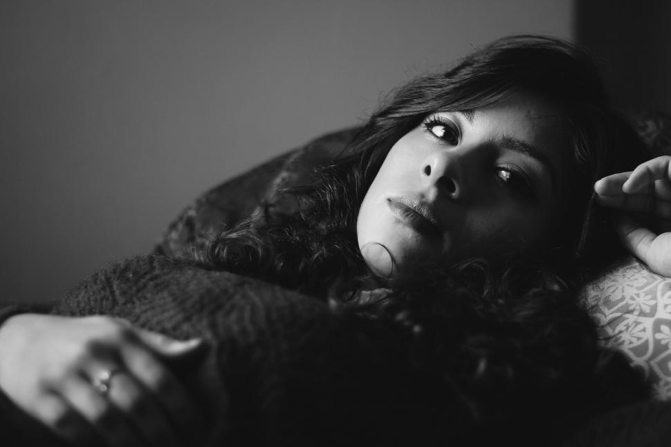 Free Image of Woman Laying on Couch 
