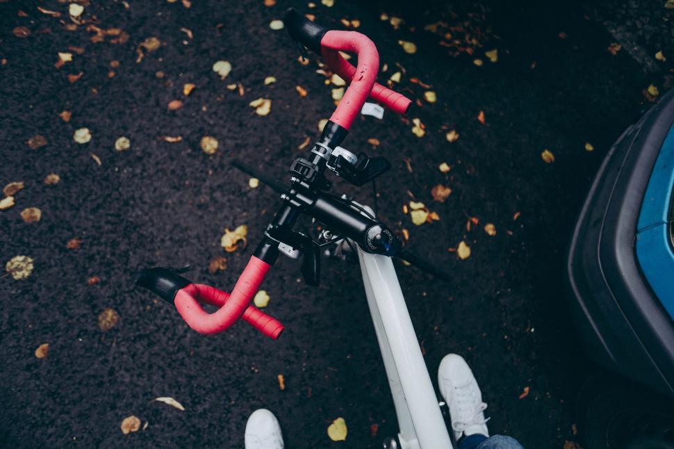 Free Image of Person Standing Next to Scooter 