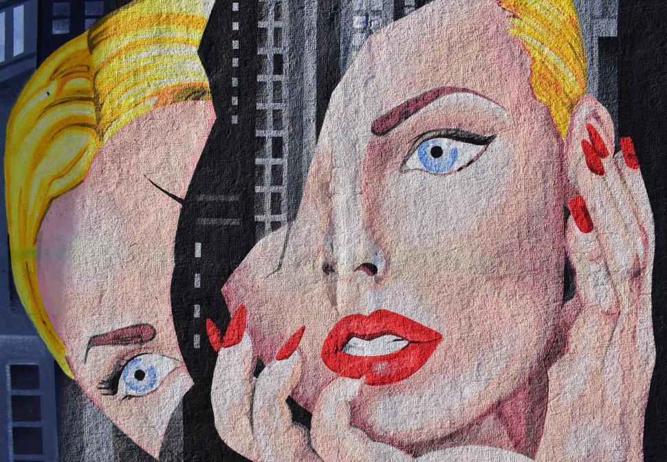 Free Image of A Painting of a Woman and a Man on a Wall 