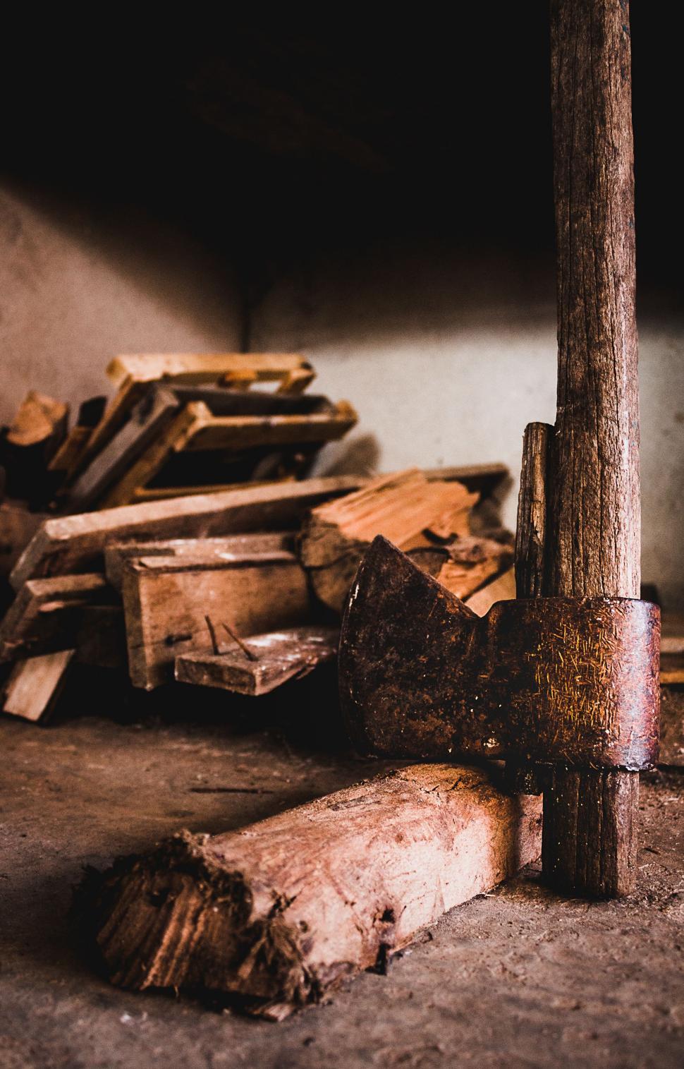 Free Image of Pile of Wood Next to Logs 