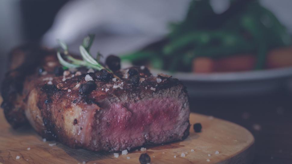 Free Image of Close Up of a Piece of Steak on a Cutting Board 