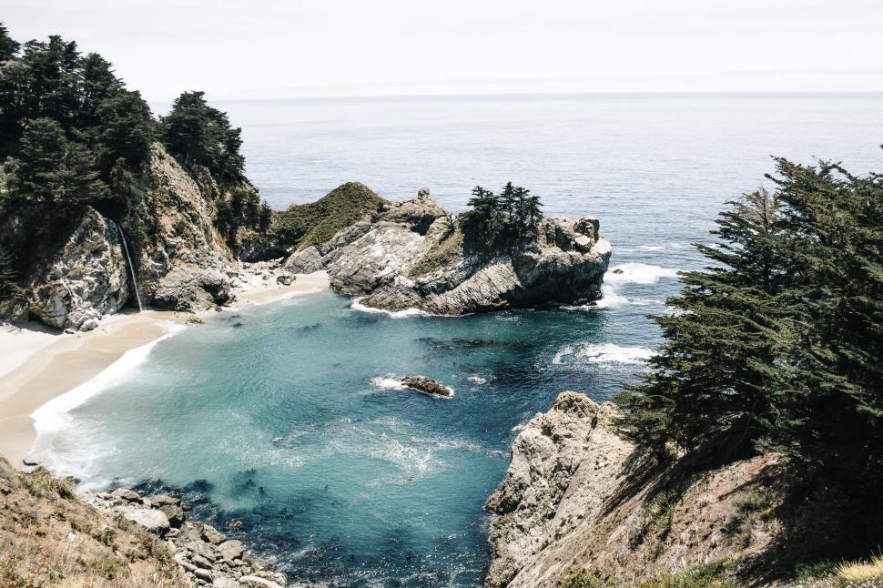 Free Image of Overlooking a Body of Water From a Cliff 