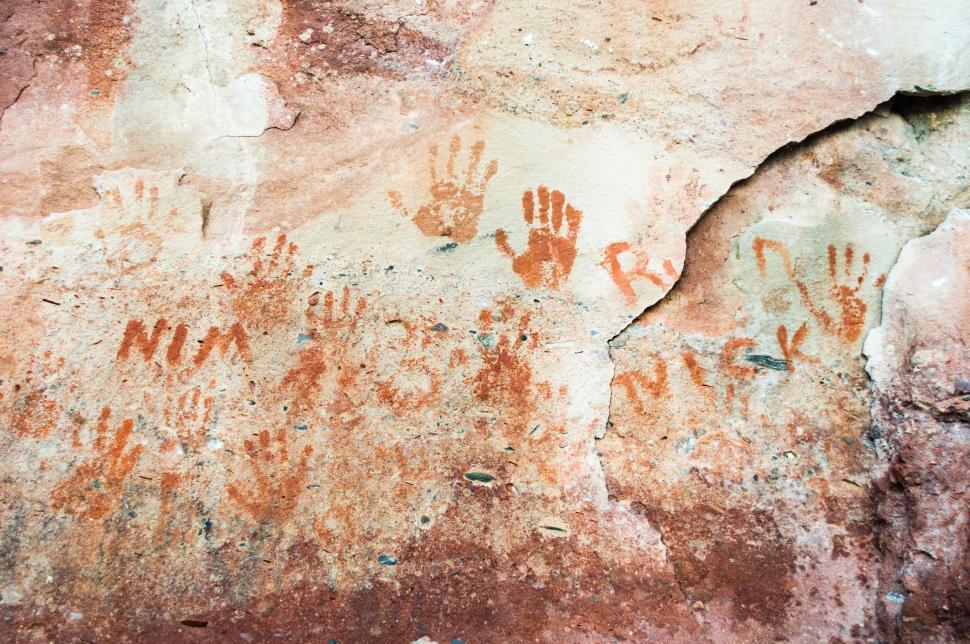 Free Image of Rock Covered in Hand Prints 