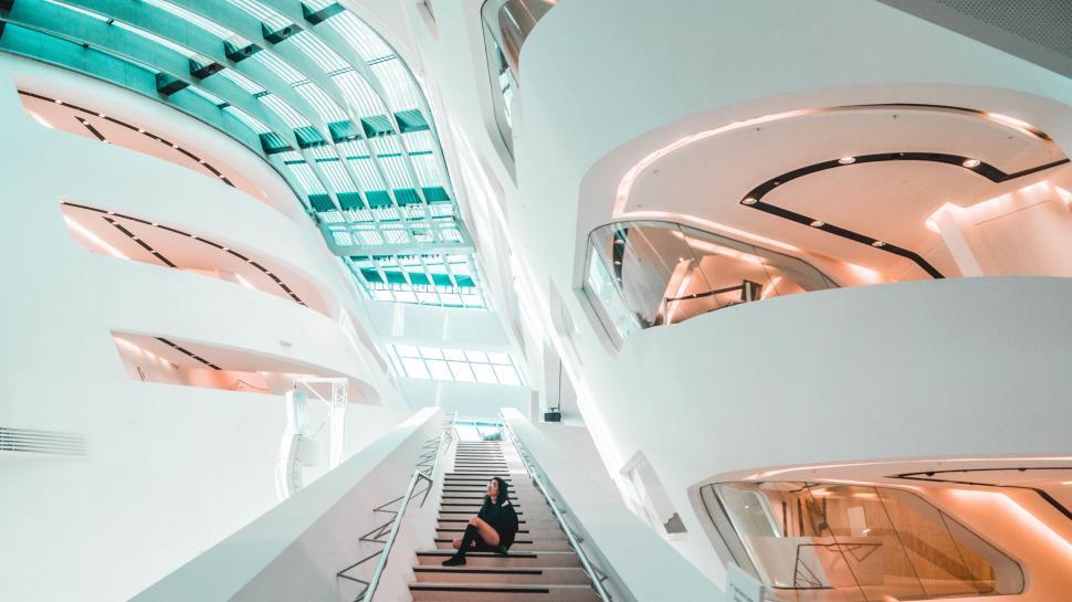 Free Image of Person Sitting on Staircase in Building 