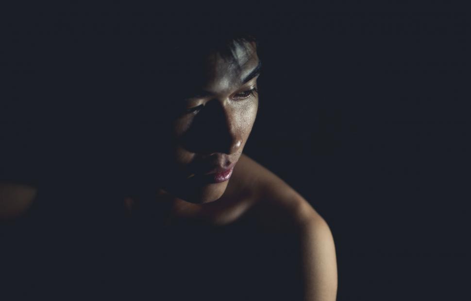 Free Image of Shirtless Man Staring at Camera in Darkness 