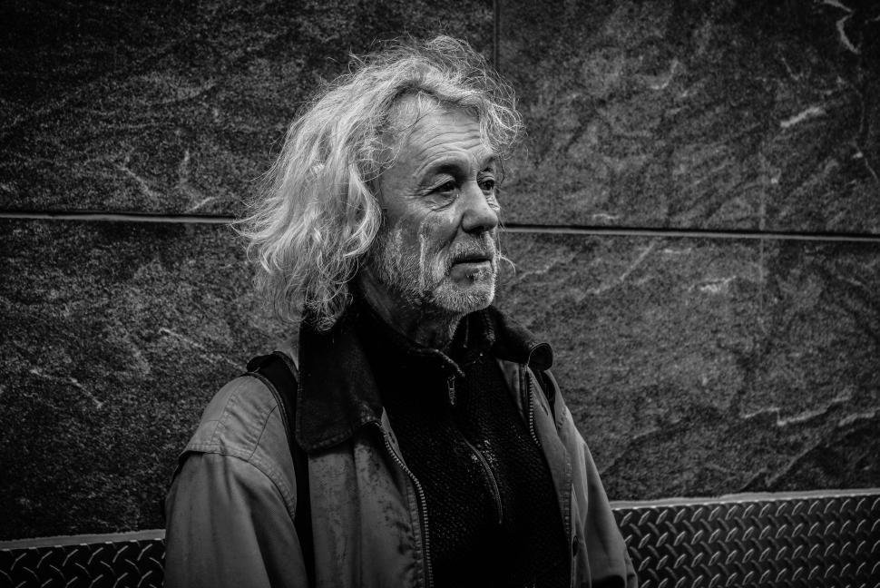 Free Image of Man Sitting on a Bench 