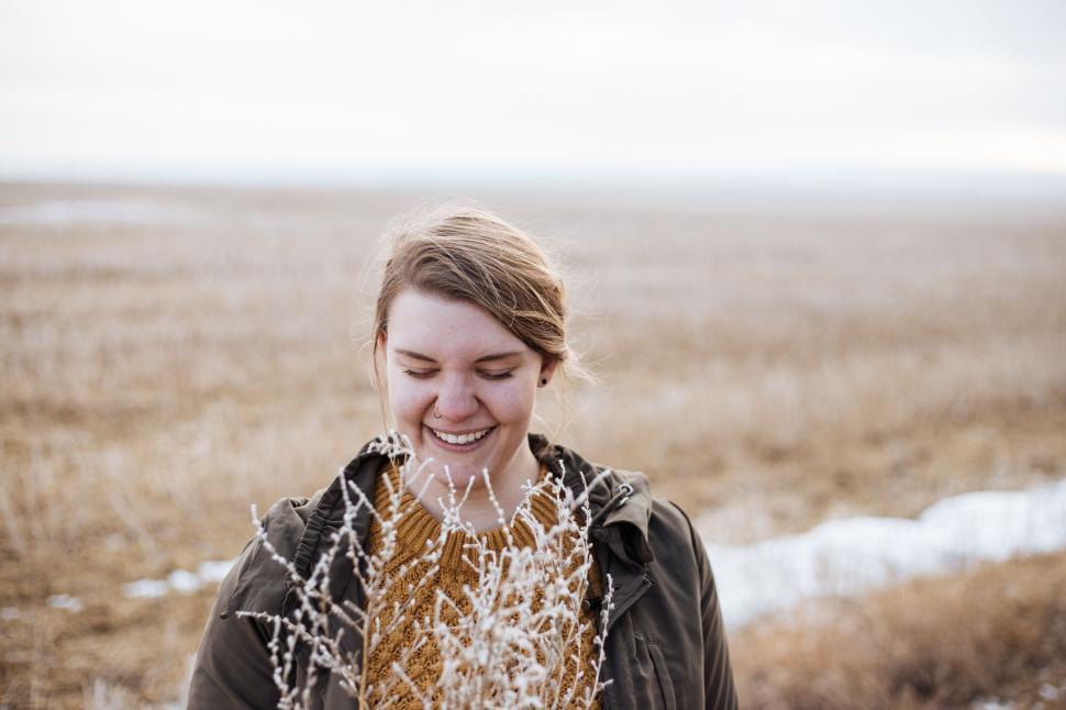 Free Image of Woman Standing in Field With Grass 