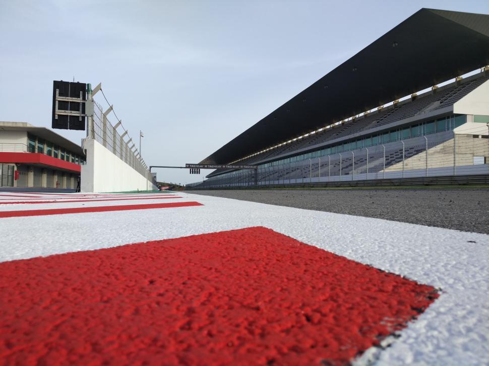 Free Image of Red and White Striped Area in Front of Building 