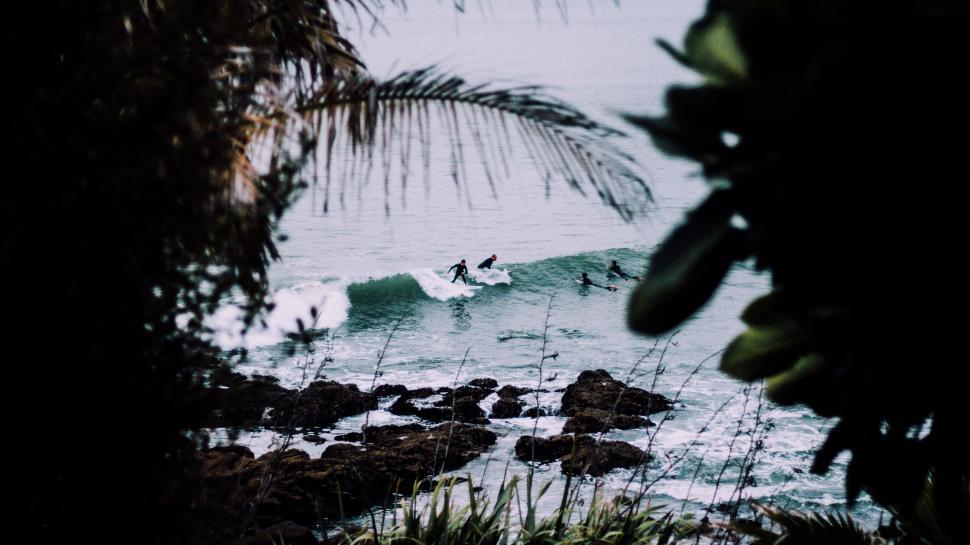 Free Image of Surfer Riding a Wave in the Ocean 