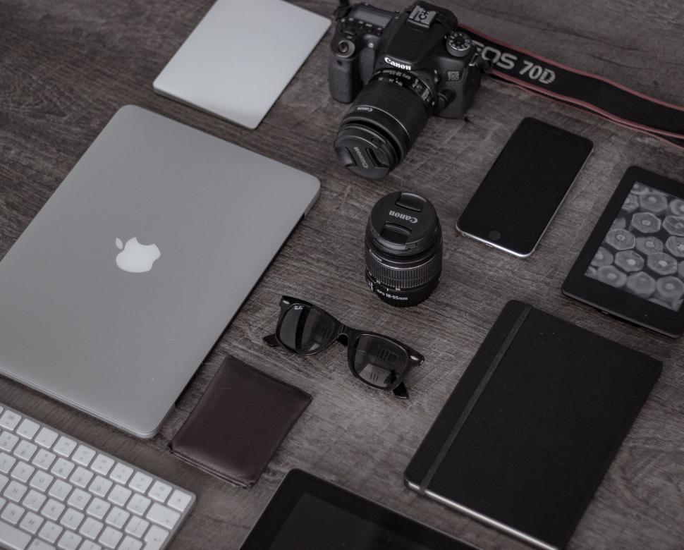 Free Image of Organized Desk Setup With Laptop, Keyboard, and Camera 