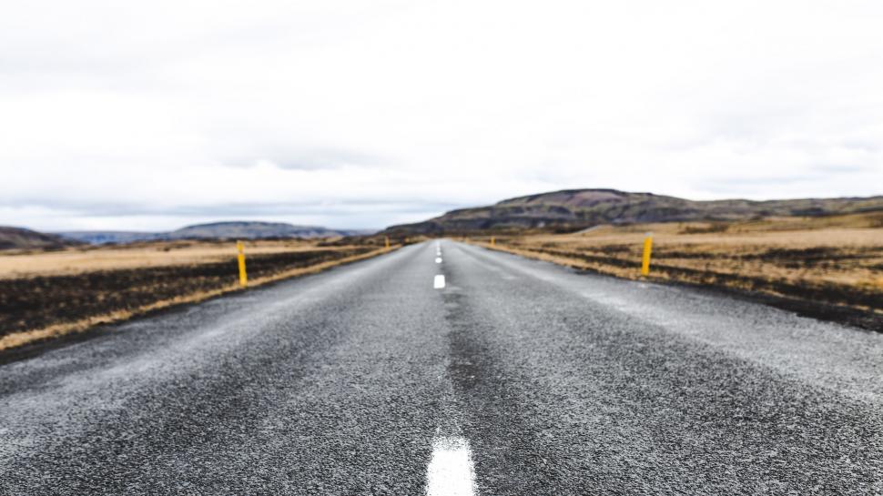 Free Image of Remote Road Stretching Across Vast Desert Landscape 