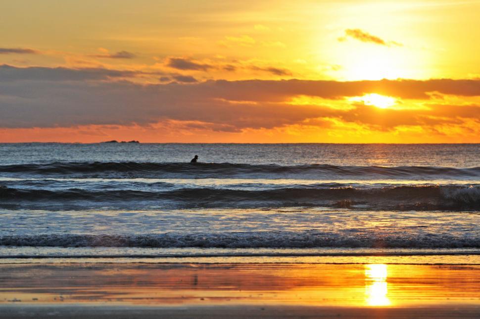 Free Image of Person Riding Surfboard on Top of Wave 