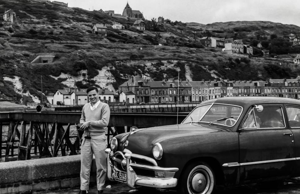 Free Image of Man Standing Next to Car 