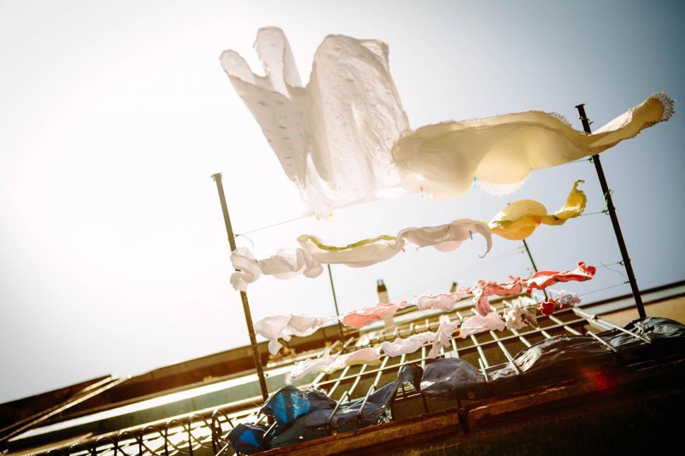 Free Image of Umbrellas Arranged on a Pole 