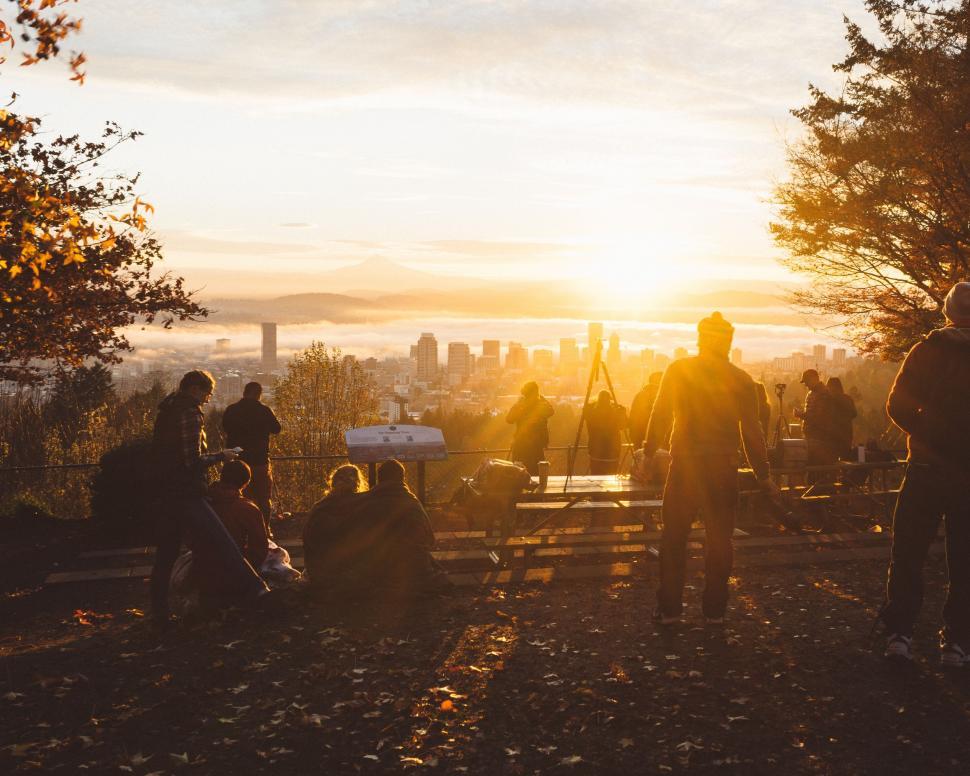Free Image of Group of People Standing on Top of a Hill 