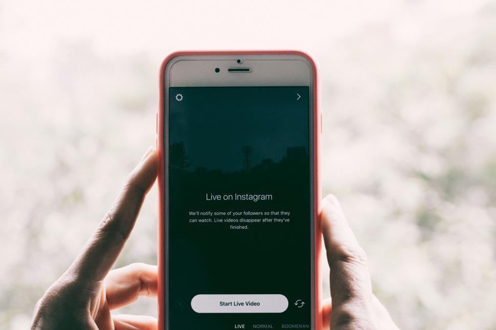 Free Image of Person Holding a Cell Phone 