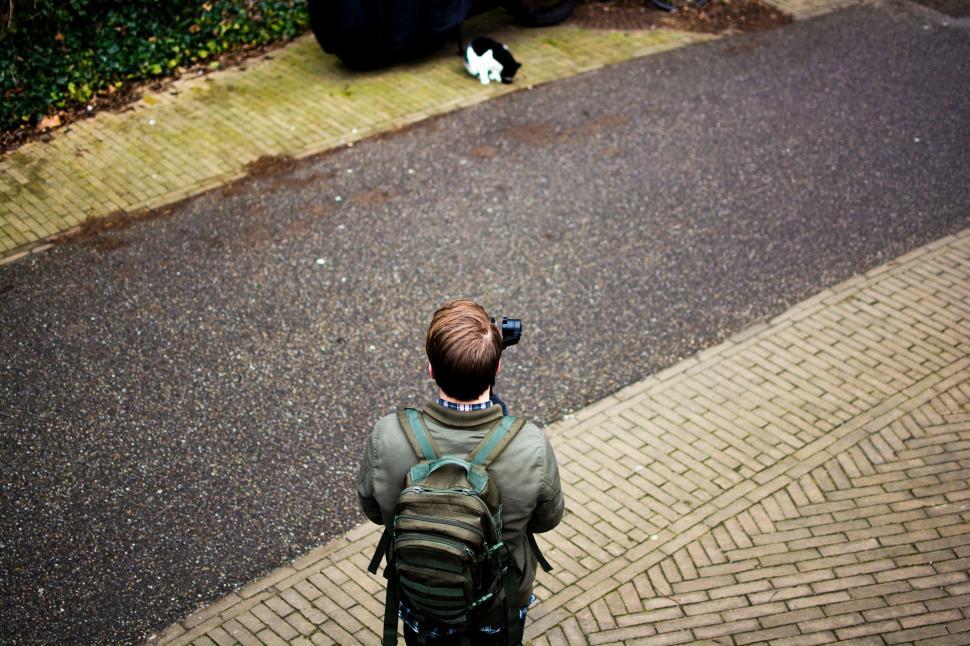 Free Image of Person Walking Down Street With Backpack 