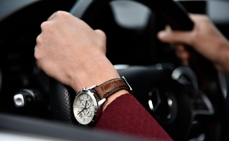 Free Image of Man Driving Car With Hand on Steering Wheel 