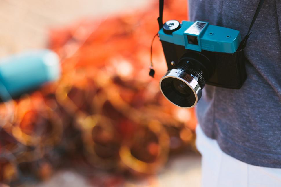 Free Image of Person Holding Camera in Hand 