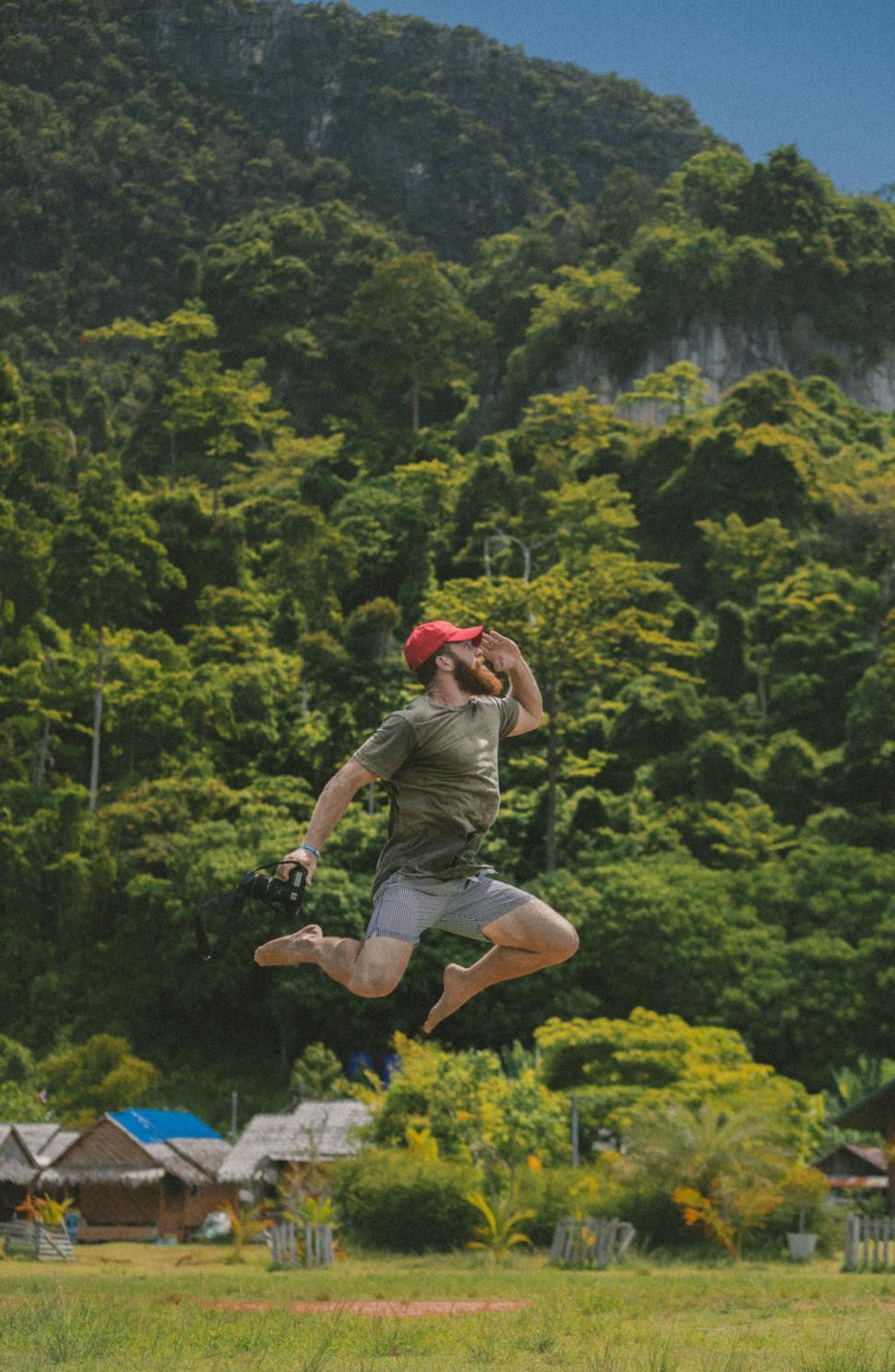 Free Image of Man Jumping in Air With Catchers Mitt 