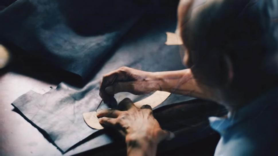 Free Image of Man Concentrated on Writing on Paper 