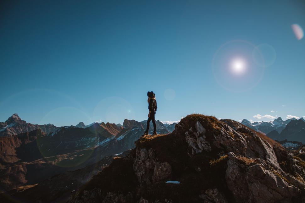Free Image of Person Standing on Top of a Mountain 