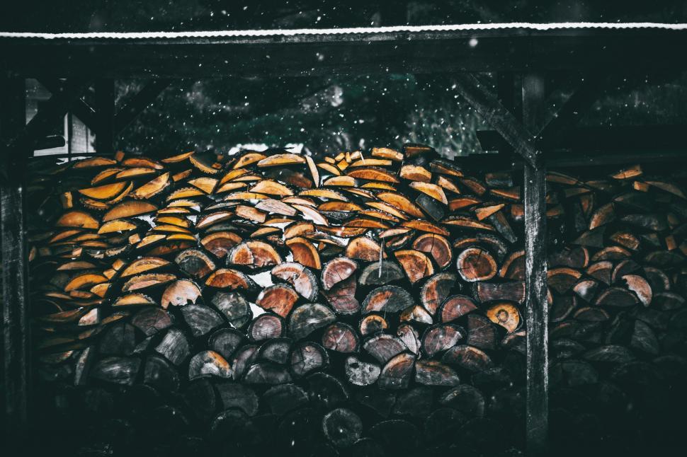 Free Image of Wood Pile Next to Firewood Stack 