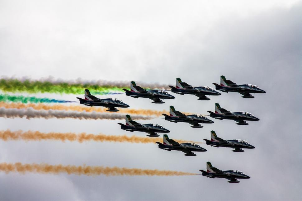 Free Image of Fighter Jets Flying Through Cloudy Sky 