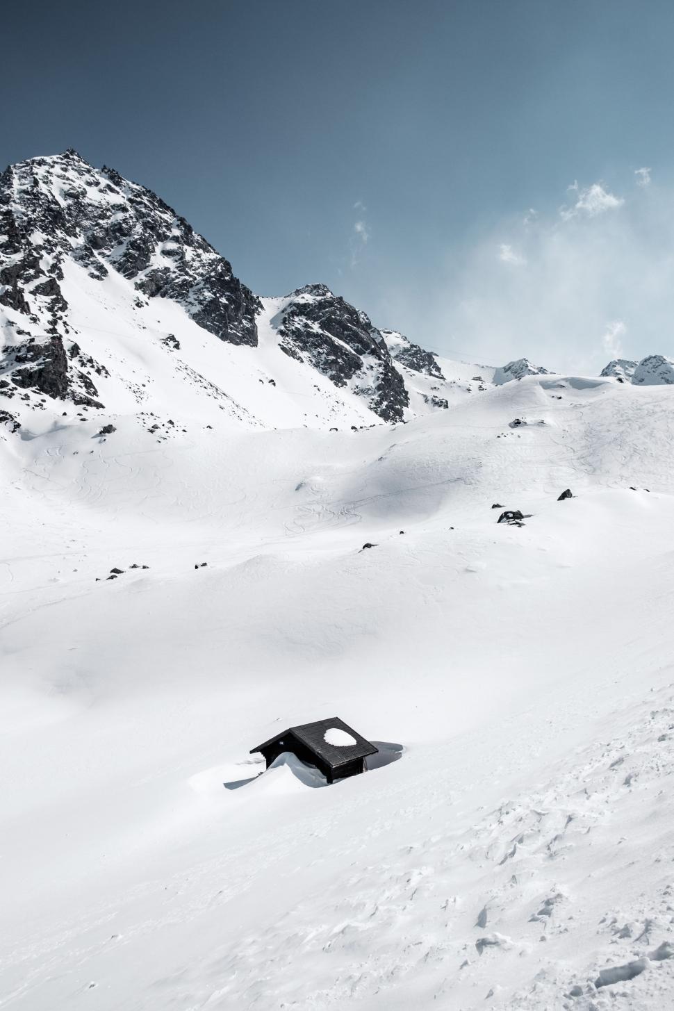 Free Image of Man Skiing Down Snow Covered Slope 