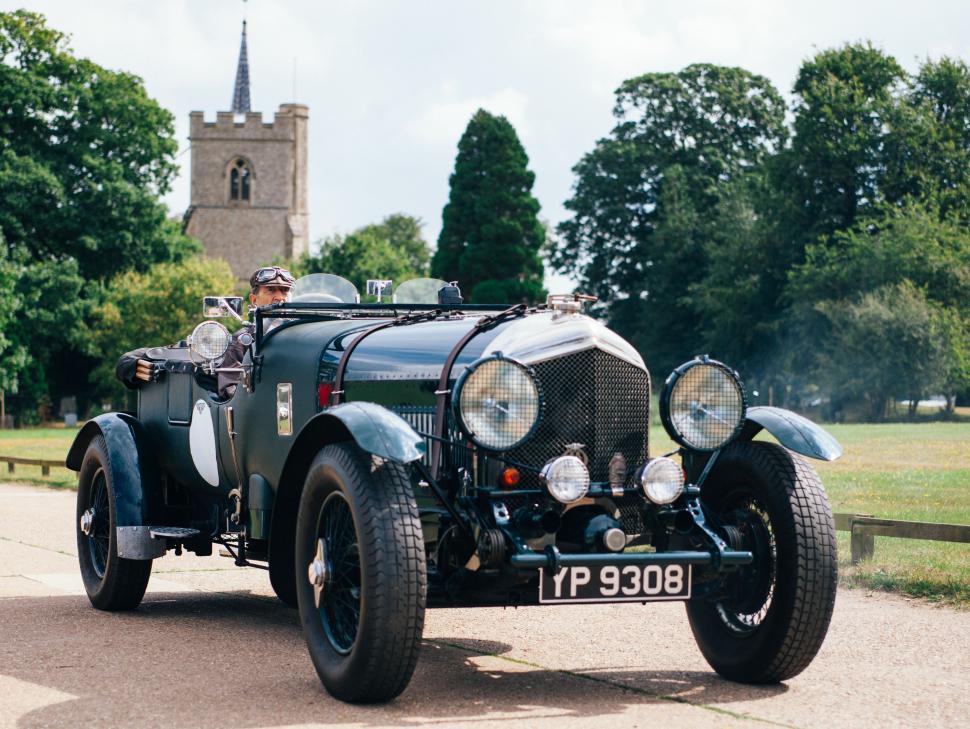Free Image of Vintage Car Parked on Side of Road 